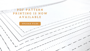 PDF sewing patterns printed in black and white on A0 or large format paper. Orange text in top left corner reads: PDF pattern printing is now available" with a button to "upload files." Upload patterns online and have them mailed to you. Vancouver, Canada