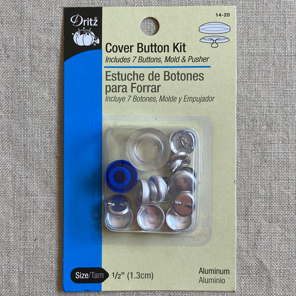 Dritz Cover Button Kit in it's package on a linen background. Kit includes 7 buttons, mold & pusher. Size is 1/2